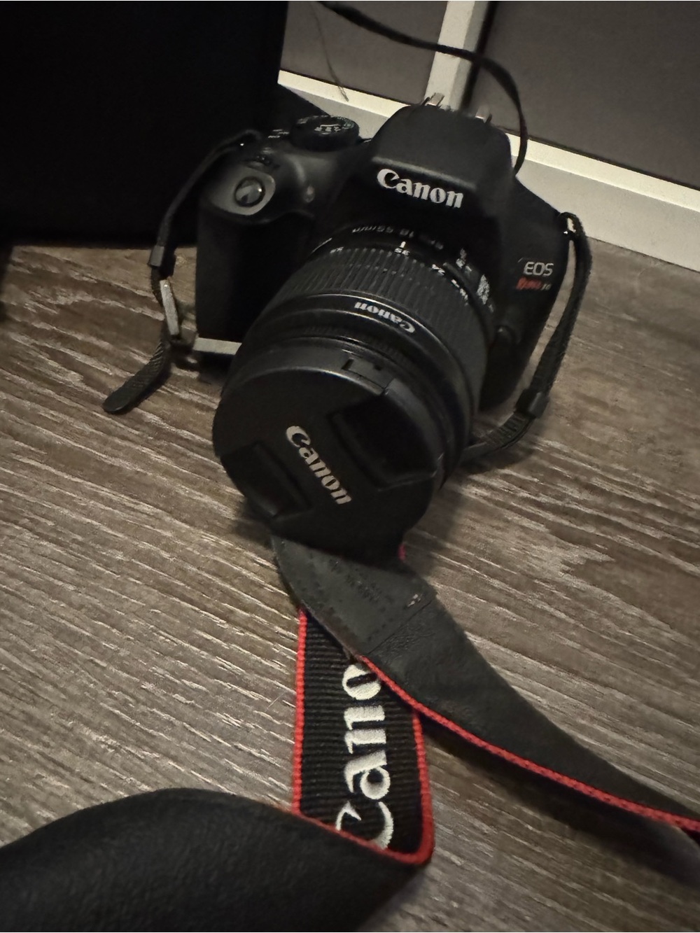 Canon Rebel T6 Camera with Black Body and Red-Trim Strap